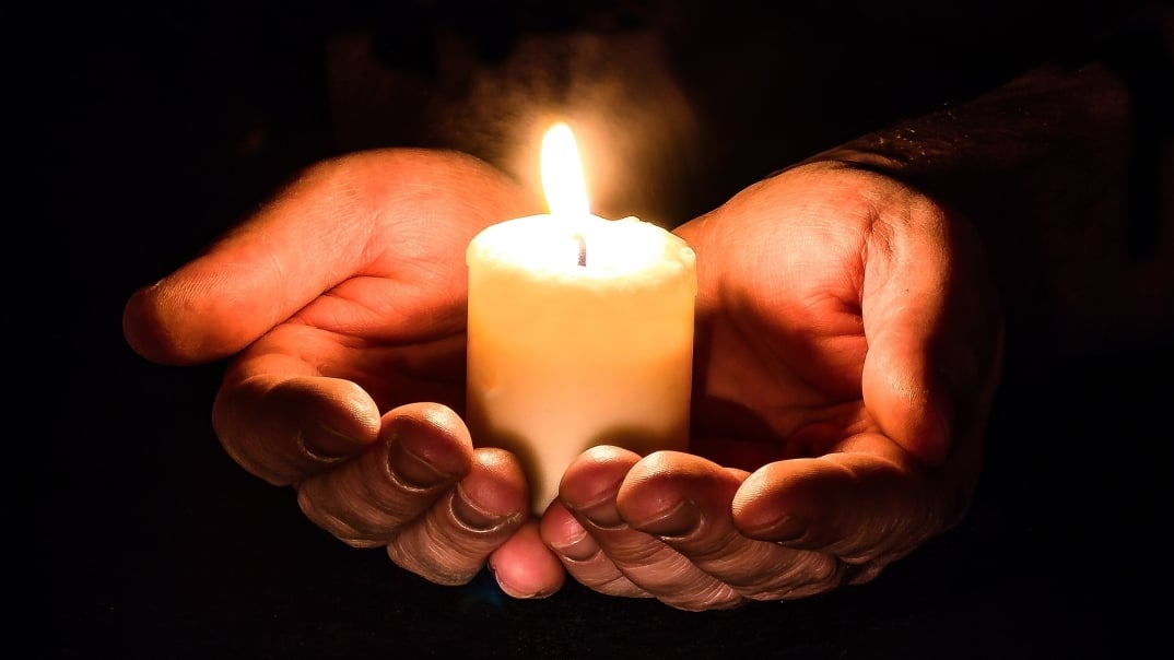 Narcissistic Abuse Coach - Hands Offering Light of a Candle